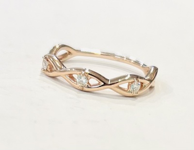 photo number one of 10 karat rose gold diamond infinity ring (.09 carat total diamond weight) item 001-120-00392