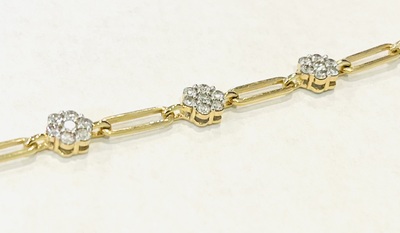 photo number one of 14 karat yellow gold 7'' paperclip bracelet with diamond clusters for a .95 carat total diamond weight item 001-125-00048