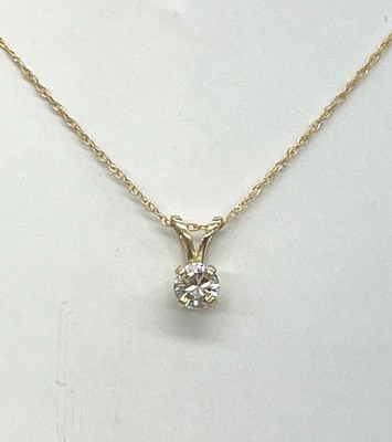 photo number one of Solitaire necklace with a 1/4 carat round natural diamond set in 14 karat yellow gold mounting on a rope style chain with spring ring clasp item 001-130-00763