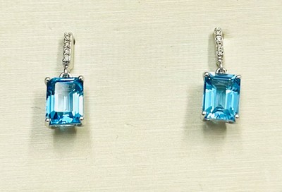 photo number one of Sterling silver blue topaz earrings with white topaz accents item 001-215-00960