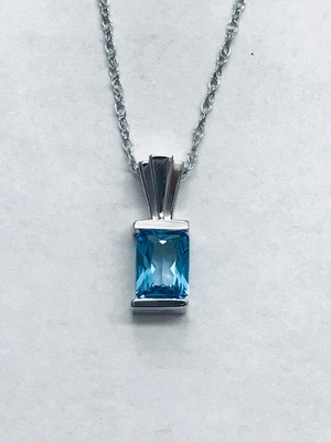 photo number one of 14 karat white gold 18'' chain with 7x5mm radiant cut blue topaz pendant item 001-230-01165