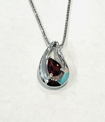 photo number one of Sterling silver garnet pendant on an 18'' chain item 001-230-01351