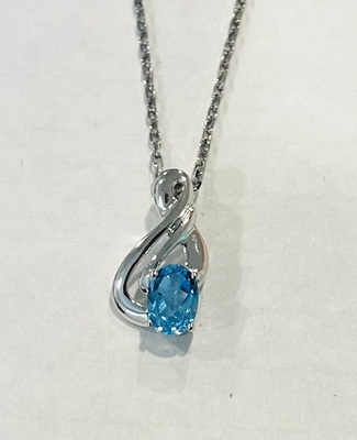 photo number one of Sterling silver blue topaz pendant on a 20'' chain item 001-230-01352