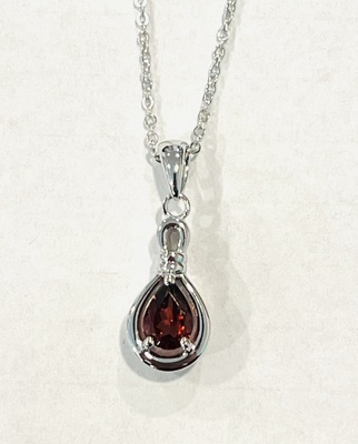 photo number one of Sterling silver garnet pendant on a 20'' chain item 001-230-01356