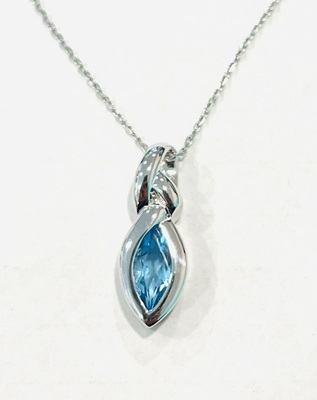 photo number one of Sterling silver blue topaz pendant on a 18'' chain item 001-230-01358