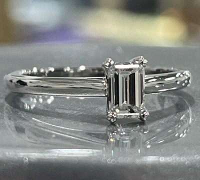 photo number one of Platinum cathedral solitaire with 0.48 carat emerald cut natural diamond VVS1 clarity and E color item 001-421-00039