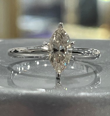 photo number one of 14 karat white gold solitaire with 0.88 carat natural marquise diamond with I1 clarity and I/J color item 001-421-00041