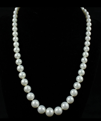 photo number one of 18'' strand of graduated 7mm to 11mm freshwater pearls with a 14 karat yellow gold clasp item 001-610-00848