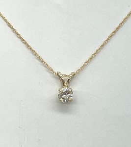 photo of Solitaire necklace with a 1/4 carat round natural diamond set in 14 karat yellow gold mounting on a rope style chain with spring ring clasp item 001-130-00763