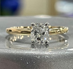 photo of 14 karat yellow gold solitaire with oval 0.72 carat natural diamond I1 clarity F/G color item 001-421-00044